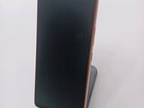 an image of a cell phone sitting on top of a stand