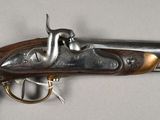 a gun that is on display on a table