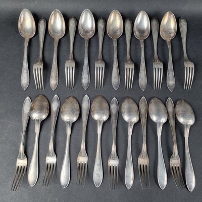 a lot of silver spoons and forks on the table
