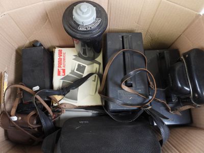 a cardboard box filled with assorted items and a fire hydrant
