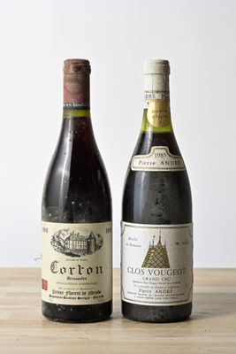 two bottles of wine that are sitting on a table