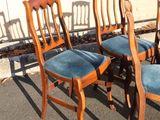 four chairs that are lined up in a row