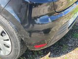 a black car parked on the side of the road