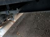 a close up of a truck ' s rear end on the road