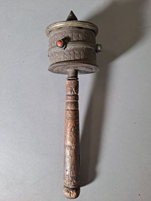 a small metal object with a red dot on it