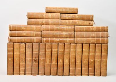 the books are stacked on top of each other on a white surface