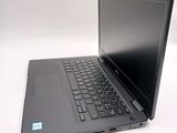 a laptop that is sitting on a white table