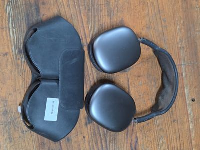 a pair of headphones and a pair of glasses on the floor