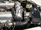 a close up of a car ' s engine with the hood up