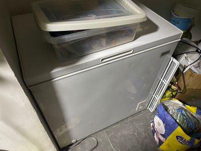 a white washer and dryer sitting next to each other in a room