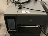 an image of a printer sitting on top of a table next to a laptop