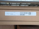 a box with a barcode on it sitting on a shelf