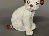 a small ceramic dog sitting on a table
