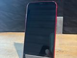 a cell phone that is sitting on a stand on a table