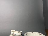 two plates and a saucer on the table