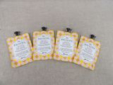 three small bags of soap sitting on top of a couch
