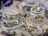 a tray with a tea set on it and a cup and saucer on the tray
