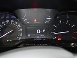 a close up of a car dashboard with a speedometer and gauges