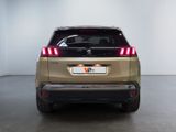 the rear end of a beige suv parked in a white room
