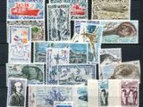 a lot of stamps that are on a black surface