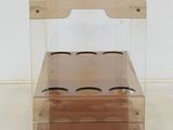 a clear table with a wooden cart on it