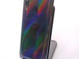 an image of a close up of a cell phone on a stand