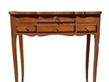 an image of a wooden table with drawers on it