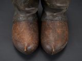 a close up of a pair of shoes on a black surface