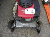 a lawn mower that is sitting on the ground