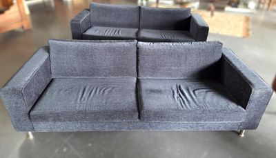a blue couch that is sitting in a room