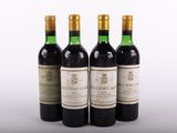 three bottles of wine sitting next to each other on a table