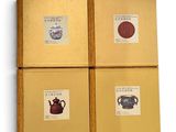 three boxes with four different types of teapots on them