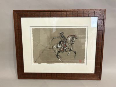 painting of a man riding a horse in a frame on a wall