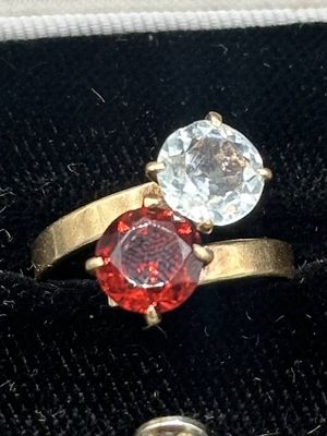 a ring with two different colored stones on it
