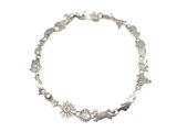 a close up of a silver bracelet on a white background