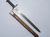 an old dagger and a knife on a white surface