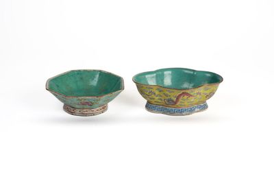 pair of green and blue bowls with designs on them on a white surface
