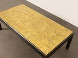 an image of a coffee table with a yellow top and black legs