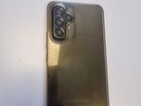 a close up of a gold iphone case on a white surface