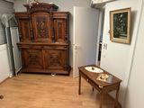 a small table with a plate on it in a room