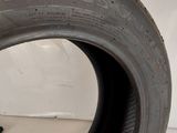 a close up of a tire on a white surface