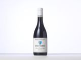 the bottle of wine is sitting on the table with a white background