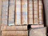 a box full of old books sitting on a table