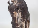 an old statue of a woman holding a baby in her arms