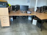 a desk with two computer monitors and a printer on it