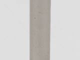 a close up of a metal object on a white surface