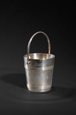 a silver bucket with handle on a black background
