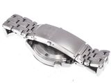 a close up of a watch on a white surface