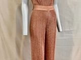a mannequin wearing a pink jumpsuit with a halt