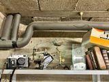 a shelf with books, a camera, and other items on it